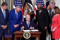 President Joe Biden signs the Inflation Reduction Act on August 16, 2022. (Photo by MANDEL NGAN/AFP via Getty Images)