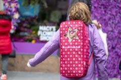 A girl wearing an "American Girl" doll and backpack (Getty Images) A girl wearing an "American Girl" doll and backpack (Getty Images)