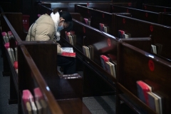 A worshiper reads the Bible after a Christmas Day service at a Protestant church in Shanghai. (Photo by Jessica Yang / AFP via Getty Images)