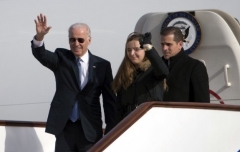 Then-Vice President Joe Biden, accompanied by his son, Hunter Biden, and granddaughter, Finnegan Biden, after arriving in Beijing in 2013. (Photo by Ng Han Guan / AFP via Getty Images)