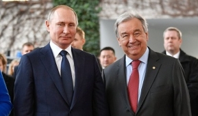 Russian President Vladimir Putin and U.N. Secretary-General Antonio Guterres at a Libya peace conference in Berlin in January 2020. (Photo by John MacDougall / AFP via Getty Images)