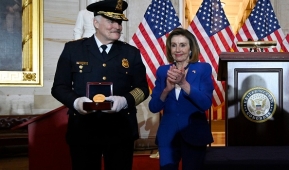 Speaker of the House Nancy Pelosi (D-Calif.) applauds US Capitol Police Chief John Thomas Manger during a Congressional Gold Medal Ceremony on December 6, 2022 in honor of those who protected the Capitol on January 6, 2021. (Photo by OLIVIER DOULIERY/AFP via Getty Images)