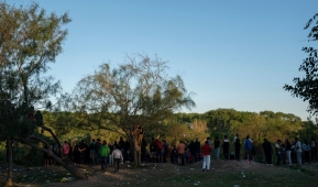 Migrants look at the Rio Grande, where people are crossing into the United States to seek asylum, in Matamoros, Tamaulipas, Mexico, on December 22, 2022. (Photo by VERONICA G. CARDENAS/AFP via Getty Images)