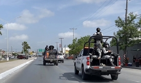 A convoy of Mexican National Guard and military vehicles transfer two Americans who survived a kidnapping ordeal to a border crossing between the Mexican city of Matamoros and Brownsville, Texas on Tuesday. Two Americans seized with them were killed. (Photo by STR/AFP via Getty Images)