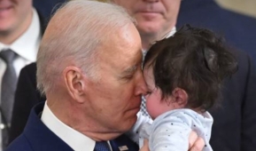 President Joe Biden greets Hodge, the son of Rep. Jimmy Gomez (D.-Calif.), March 23, 2023. (Photo by Saul Loeb/AFP via Getty Images)