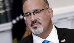 Education Secretary Miguel Cardona says schools may not impose a blanket ban on transgender males joining female sports teams. (Photo by OLIVIER DOULIERY/AFP via Getty Images)