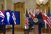 President Biden watches as Australian Prime Minister Scott Morrison speaks during Wednesday’s joint announcement. British Prime Minister Boris Johnson, out of frame, also participated by video link. (Photo by Brendan Smialowski / AFP via Getty Images)