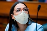 Rep. Alexandria Ocasio-Cortez, D-N.Y., is seen as Postmaster General Louis DeJoy testifies during a House Oversight and Reform Committee hearing on slowdowns at the Postal Service ahead of the November elections on Capitol Hill in Washington,DC on August 24, 2020. (Photo by TOM WILLIAMS/POOL/AFP via Getty Images)