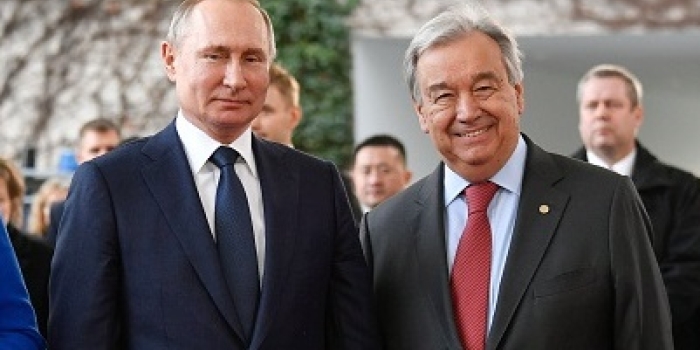 Russian President Vladimir Putin and U.N. Secretary-General Antonio Guterres at a Libya peace conference in Berlin in January 2020. (Photo by John MacDougall / AFP via Getty Images)