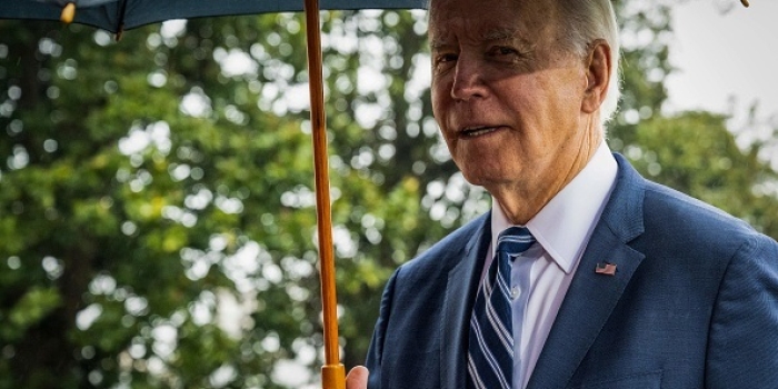 President Biden, about to depart for Arizona on Dec. 6, tells reporters he won't visit the border while there because "there are more important things going on." (Photo by SAUL LOEB/AFP via Getty Images)